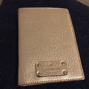 Kate Spade NWT Rose Gold Passport Holder.